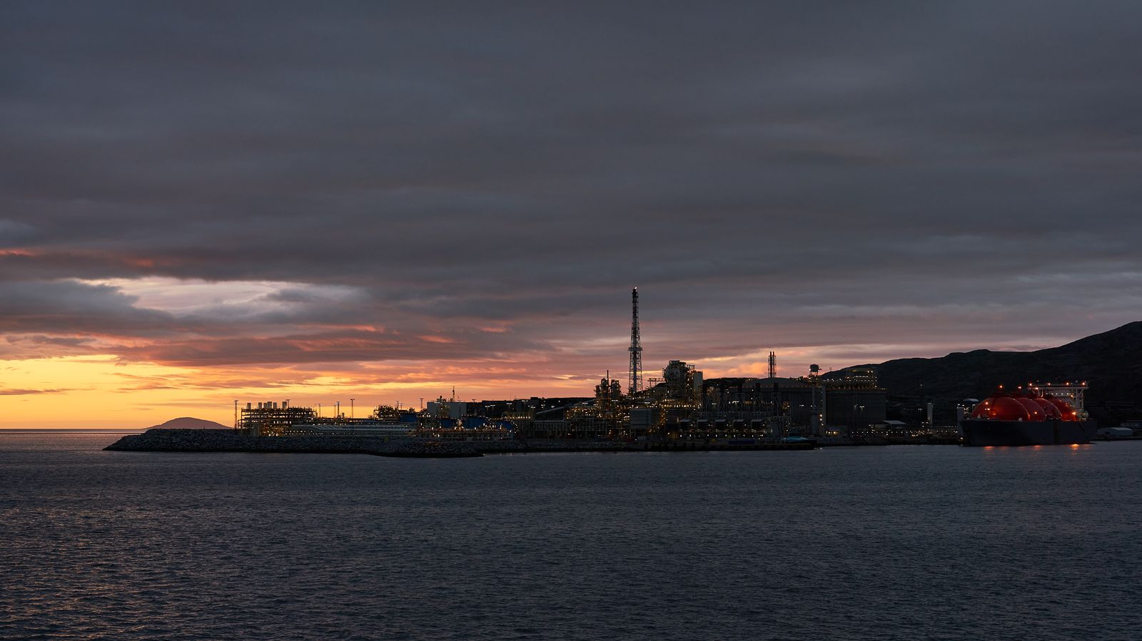 An LNG tanker docked at a liquefied natural gas terminal